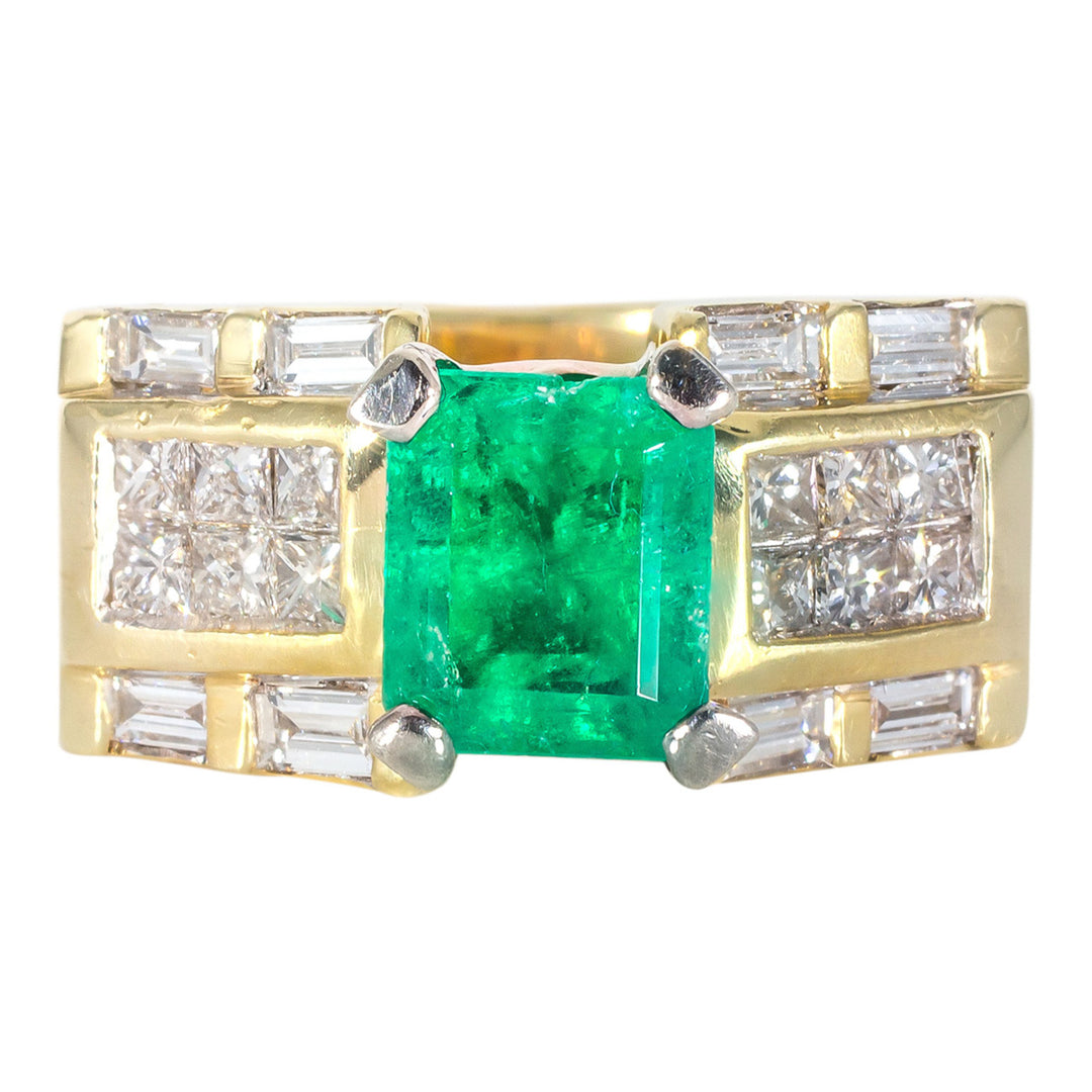 Ring in 14K YG with channel set baguettes, two-row invisible princess cut diamonds with emerald centerstone. D0.85ct.t.w. Emerald 1.47ct.