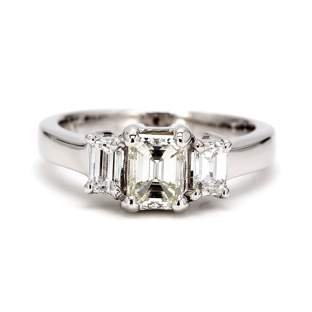 Three-stone semi-mount in platinum with emerald cut diamonds sides. D0.45ct.t.w.