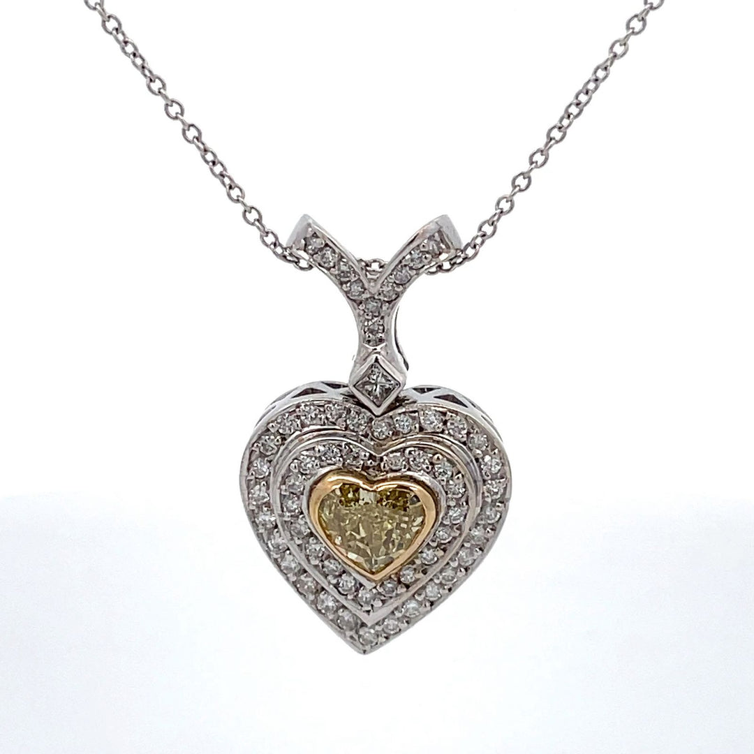 Double halo drop heart pendant with pave set rounds, square bezel set princess cut, & bezel set heart shape diamond center. D1.37ct.t.w.