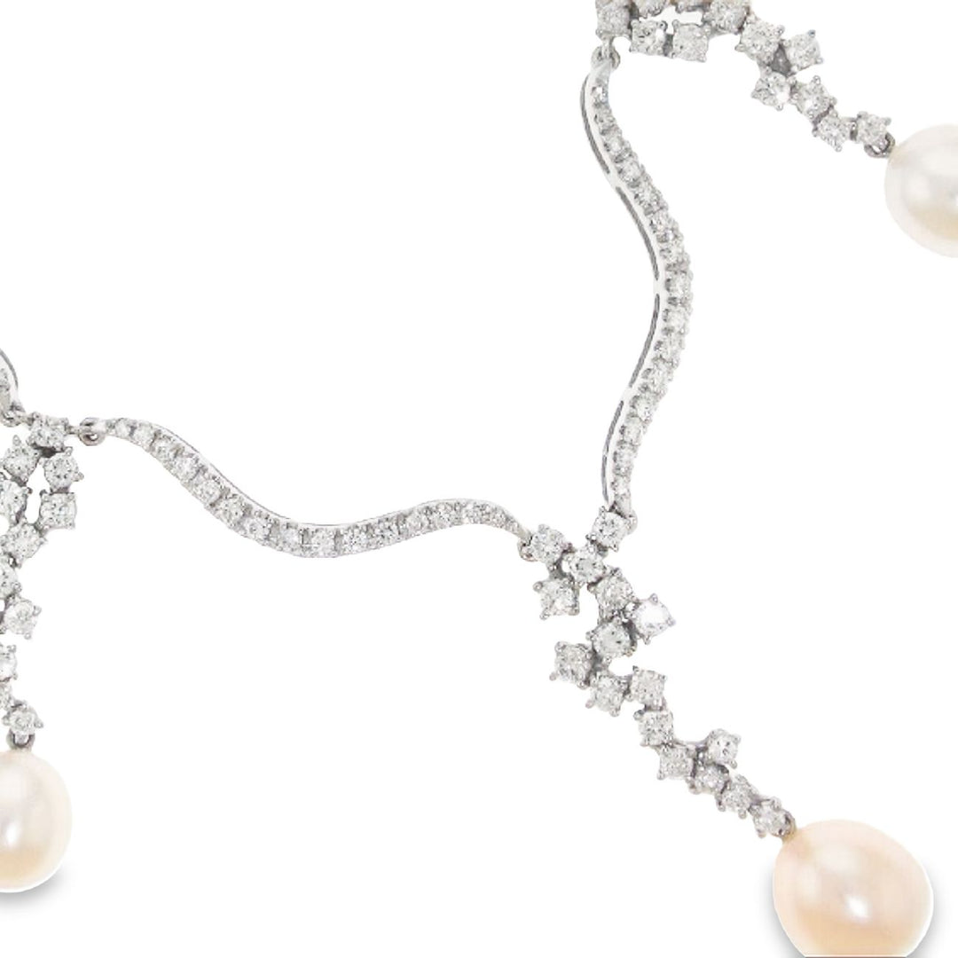 Drop pearl and diamond necklace in 18K WG with French pave set round diamonds. D6.12ct.t.w.