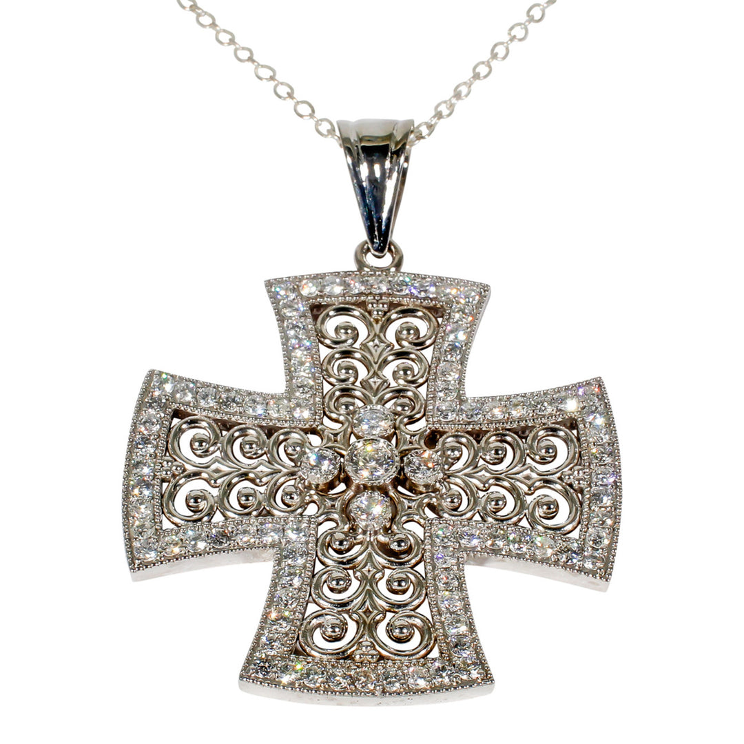 Designer cross pendant with bezel and pave set round diamonds. D1.02ct.t.w.