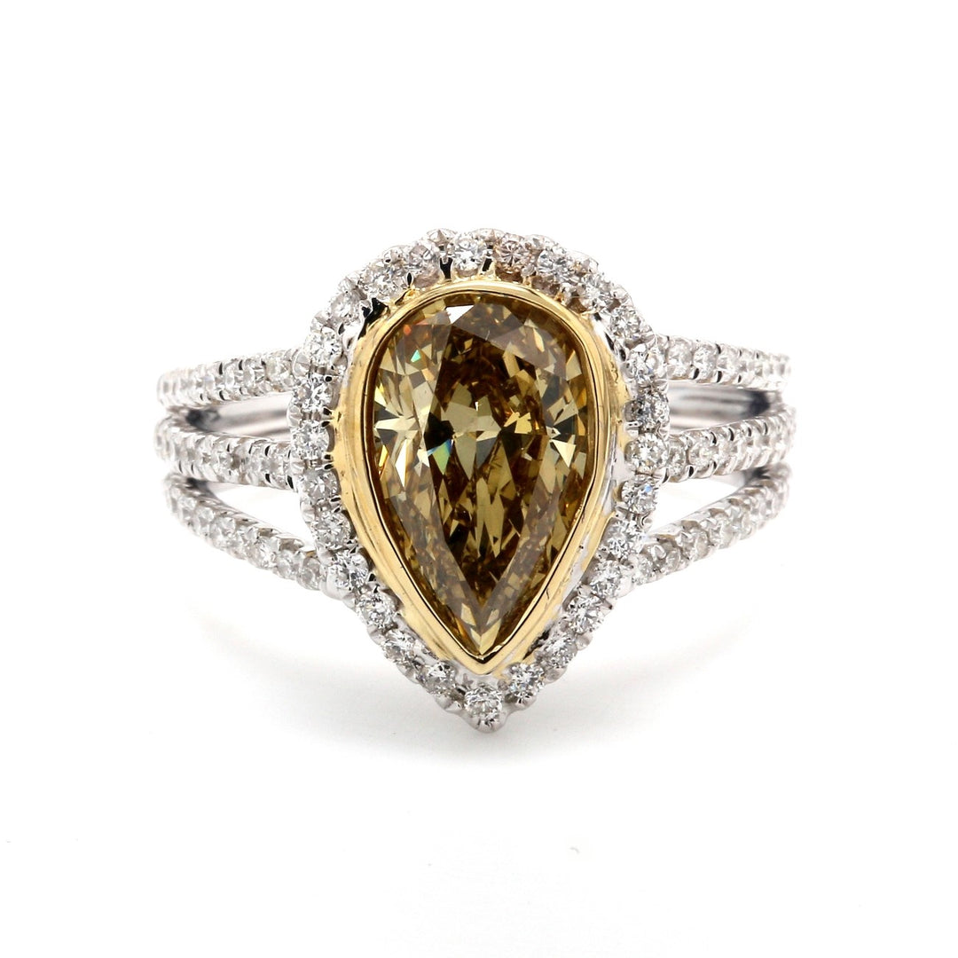 Halo ring in 18K WG with bezel set GIA certified FY/SI1 pear shape center & french pave set round diamonds on triple shank. D2.56ct.t.w. (Center 2.00ct.) Size 6.25