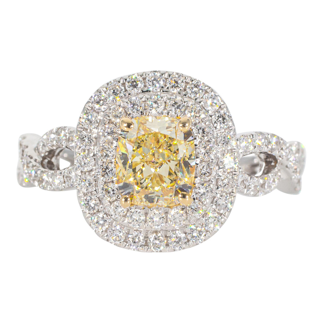 Double halo criss cross shank ring in 18K WG with rounds around a FY cushion cut diamond center stone. D1.68ct.t.w. (Center 1.08ct.) Size 6.75