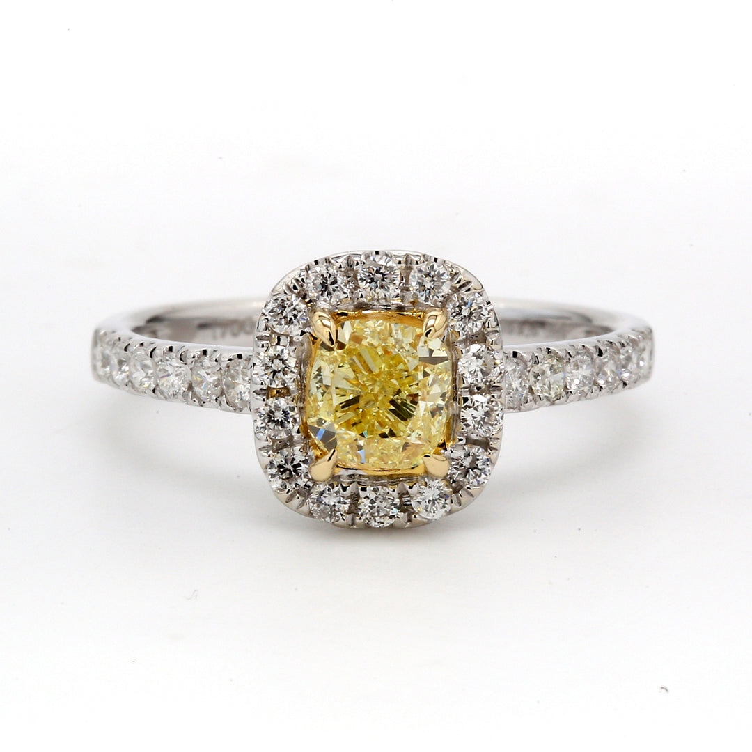 Halo ring in 18K WG with GIA certified FY/SI2 cushion cut center & french pave set round diamonds. D1.26ct.t.w. (Center 0.85ct.) Size 6.5