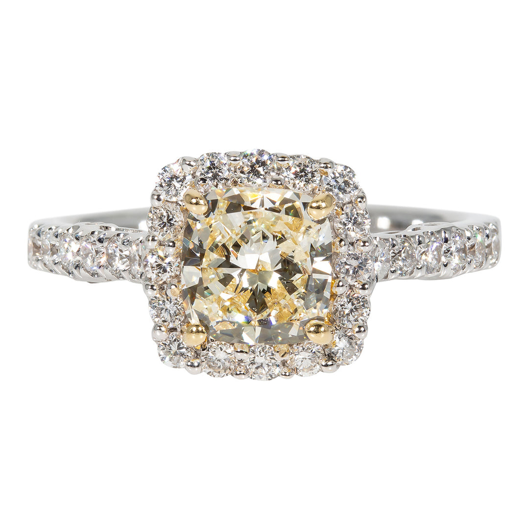 Halo ring in 18K WG with prong set rounds on shank and around FY cushion cut diamond center stone. D1.70ct.t.w. (Center 1.20ct.) Size 6.75