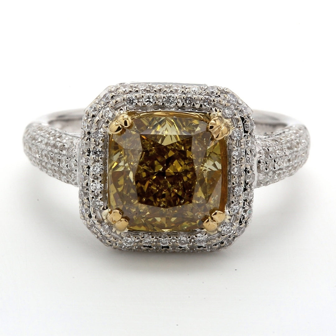Halo ring in 18K WG with GIA certified FDBY/SI2 cushion center & french pave set round diamonds. D3.59ct.t.w. (Center 2.83ct.)