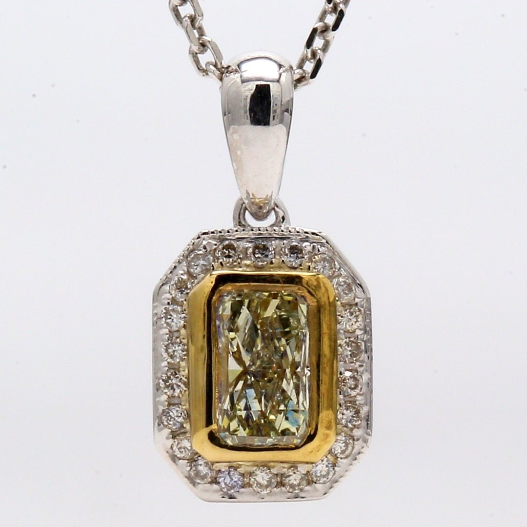 Halo pendant with pre-set rounds & square bezel set fancy yellow radiant diamond center. D0.64ct.t.w. (Center 0.52ct.)