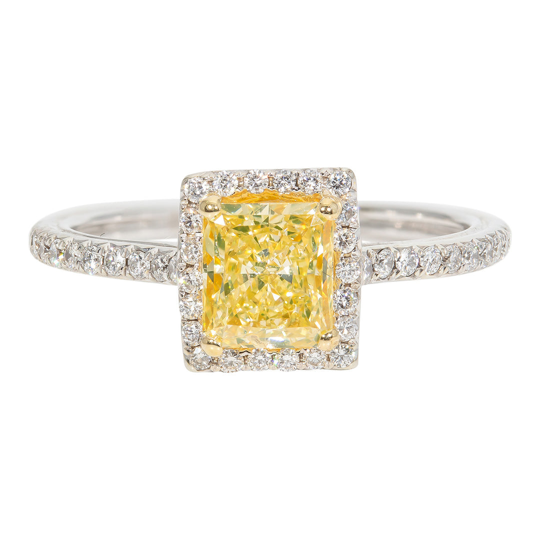 Halo ring with French pave set roundds around 4-prong set GIA certified FY/SI1 radiant cut diamond center stone. D1.30ct.t.w. (Center 1.05ct.)