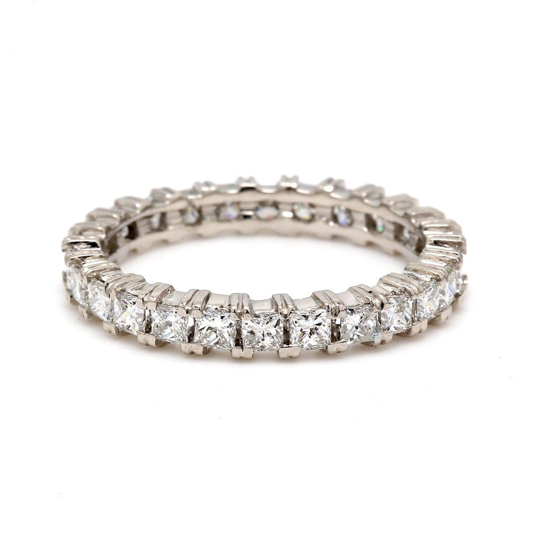 Eternity band in platinum with shared prong set (26) princess cut diamonds. D1.47ct.t.w.