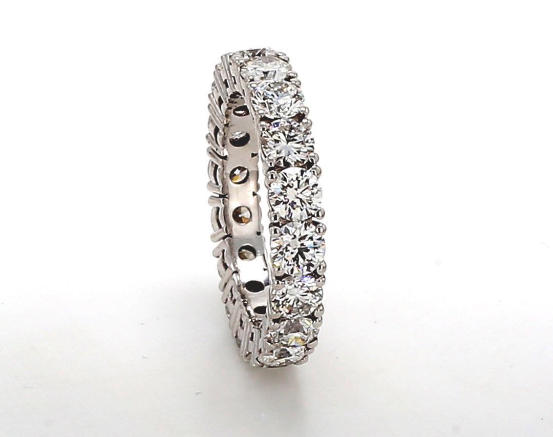 Eternity band in 18K WG with 4-prong set (18) round diamonds. D3.33ct.t.w. Size 5