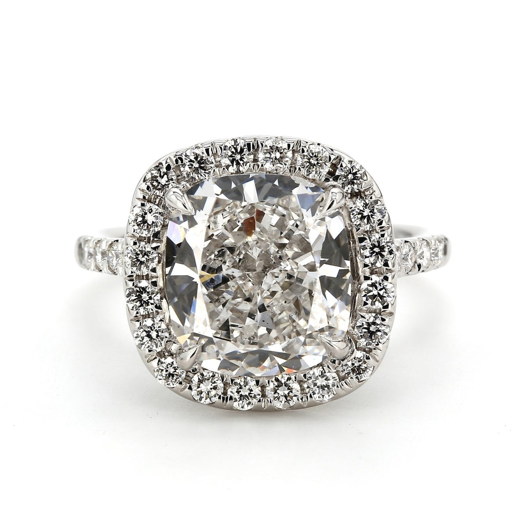 Halo ring with 4-prong U-set rounds on each side and on gallery with GIA certified E/SI1 cushion cut diamond center. D5.77ct.t.w. (Center 5.03ct.)