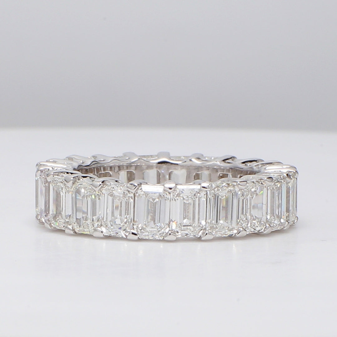 Eternity band with shared prong set (22) emerald cut diamonds. D7.15ct.t.w. Size 7