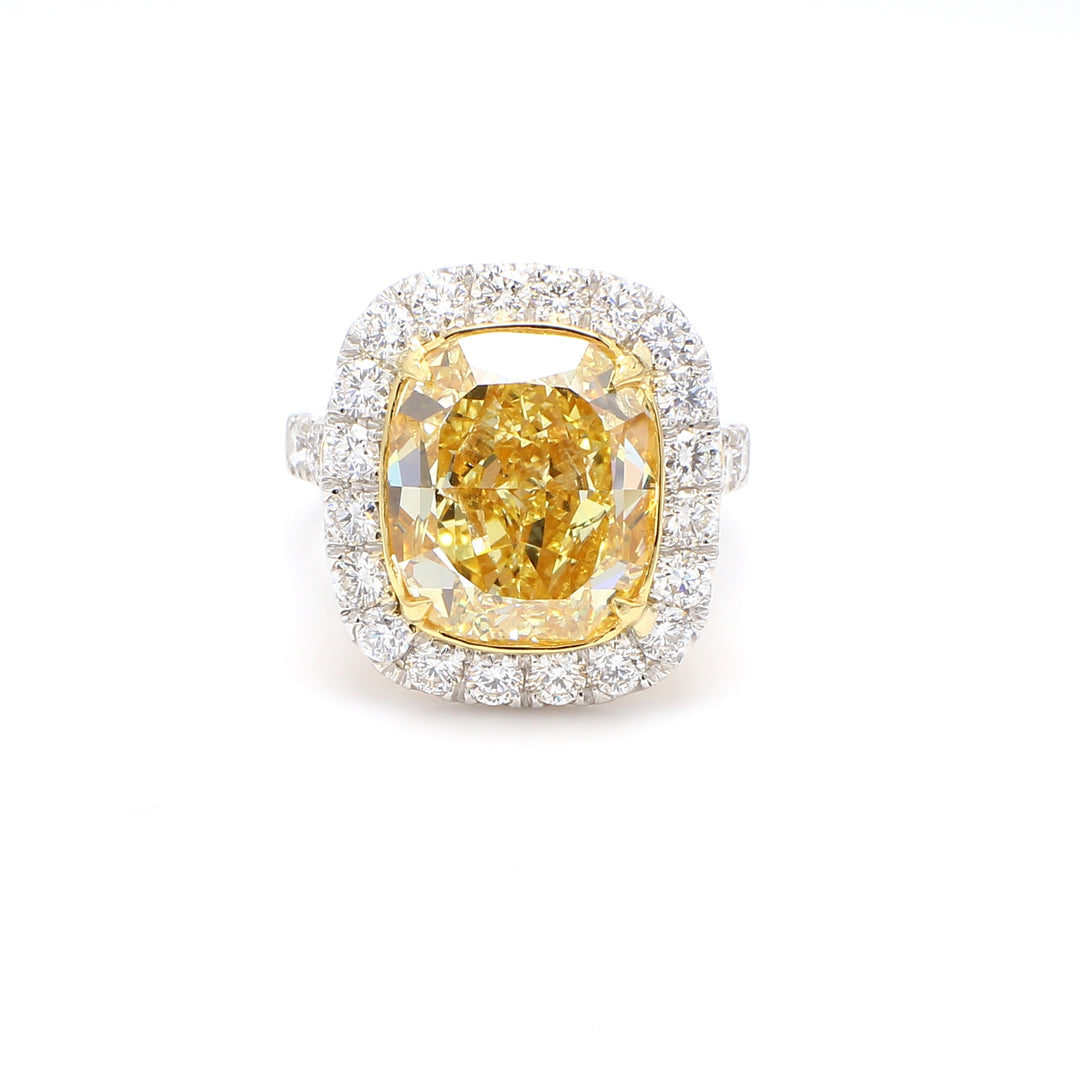 Halo ring in platinum and 18K with GIA certified FIY/SI2 cushion cut center & prong set round diamonds. D11.73ct.t.w. (Center 10.01ct.)