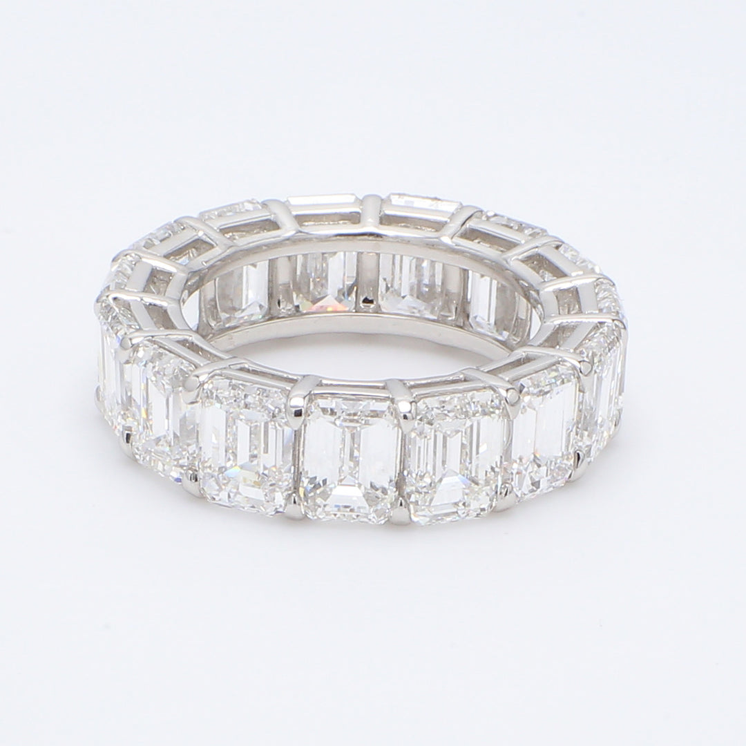 Eternity band in platinum with shared prong set GIA certified E-F/VVS-VS2 (15) emerald cut diamonds. D10.60ct.t.w. Size 5