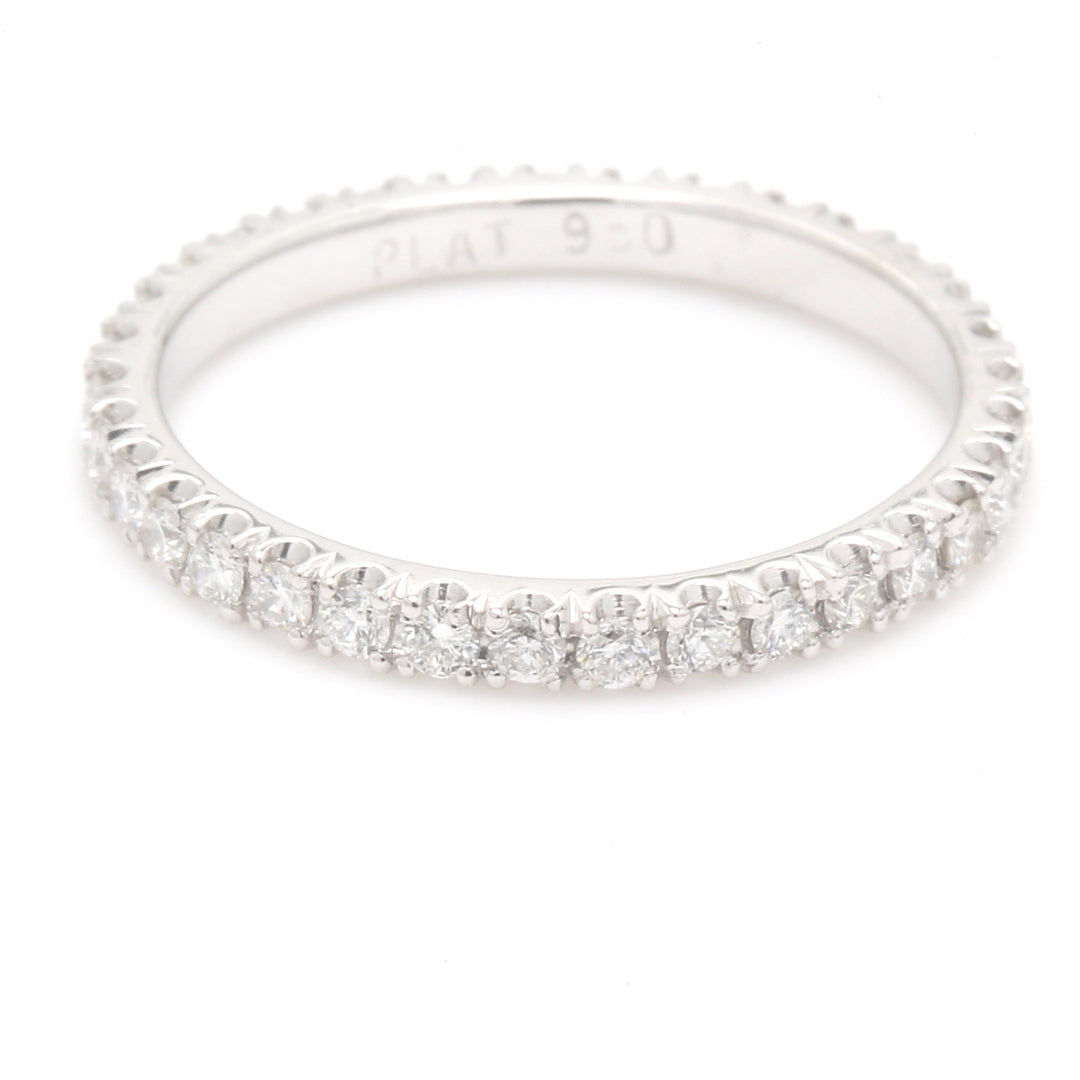 Eternity band in platinum with prong set round diamonds. D0.52ct.t.w.
