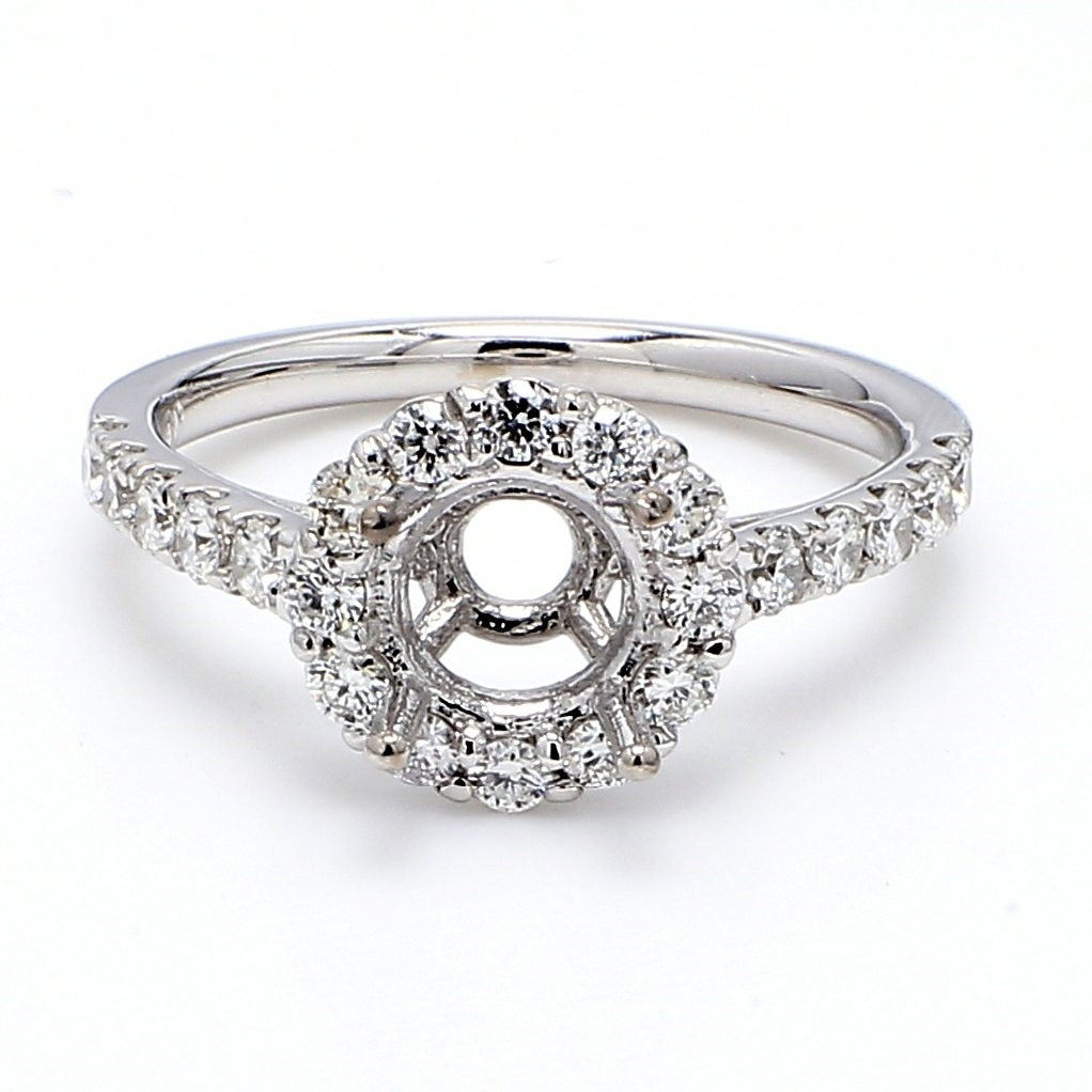 Halo semi-mount with shared prong set round diamonds. D0.64ct.t.w. Size 6.5
