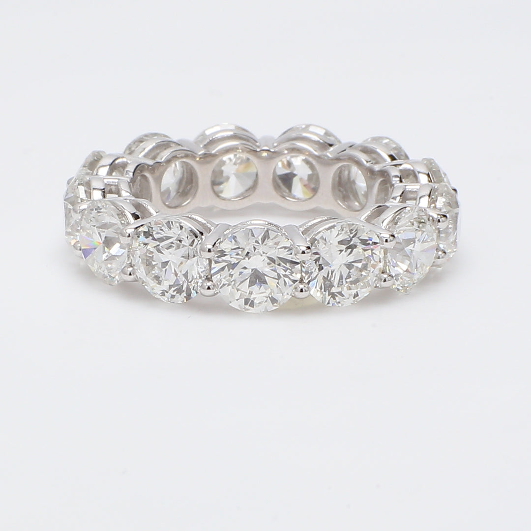 Eternity band in platinum with shared prong set round diamonds. D9.16ct.t.w.