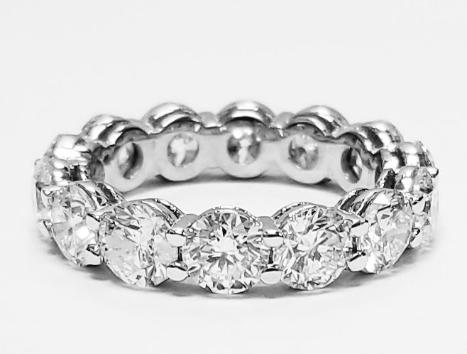 Eternity band in platinum with shared prong set (14) round diamonds. D7.05ct.t.w. Size 6.25
