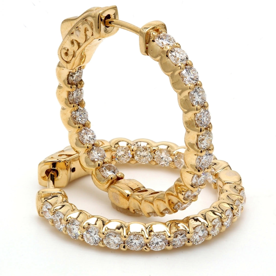 0.75"" Inside out hoop earrings in yellow gold with shared prong set (38) round diamonds & with special spring lock. D1.46ct.t.w.