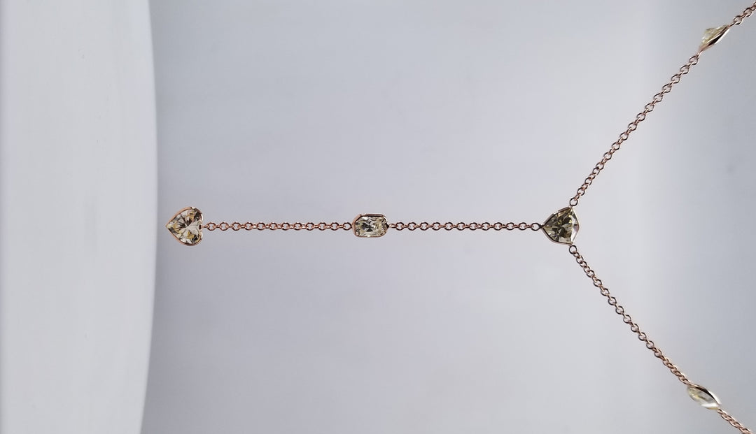 18"" Drop necklace in 18K RG with bezel set radiant, oval, heart, & trilliant diamonds. D3.96ct.t.w.
