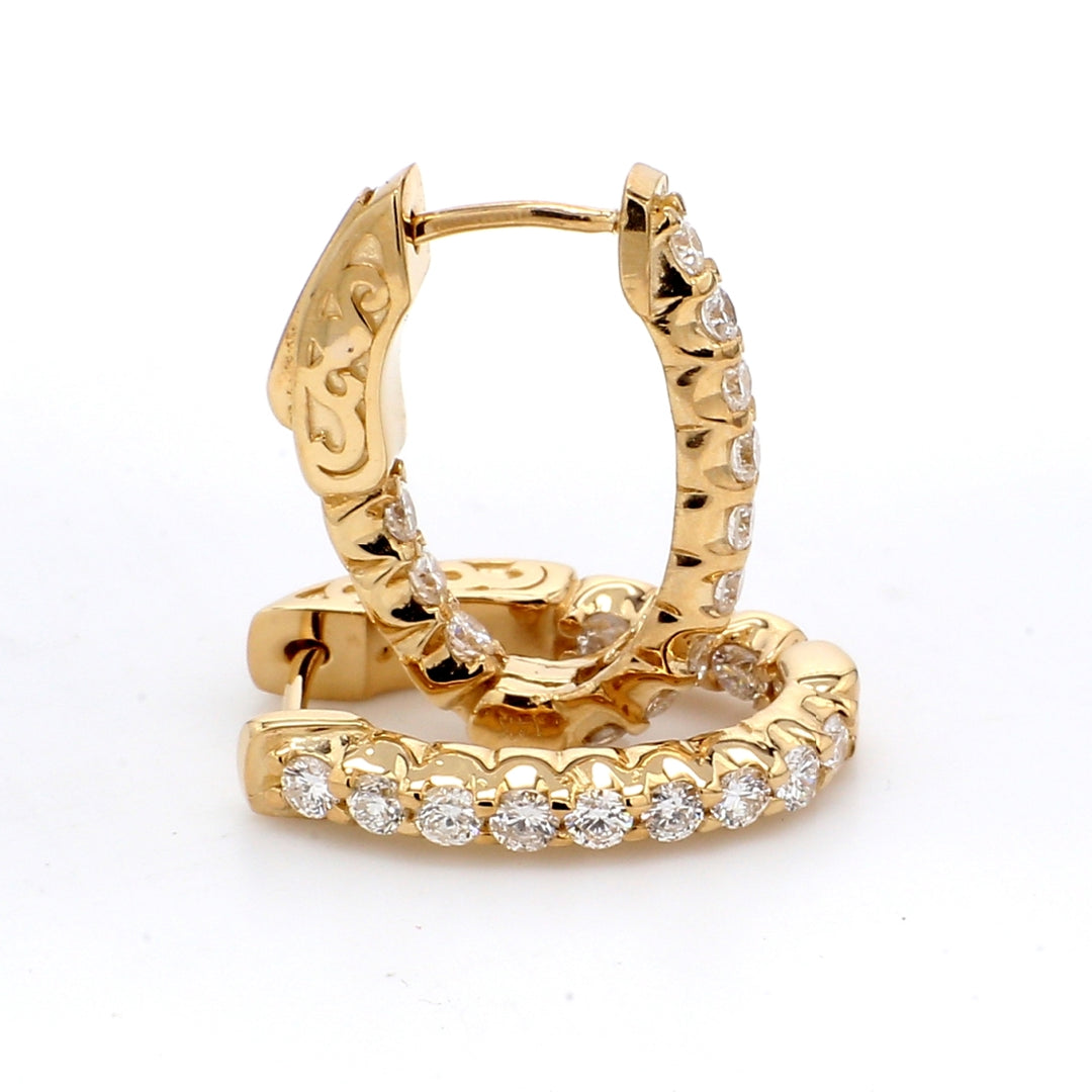 0.75"" Inside out hoop earrings in yellow gold with shared U-prong set round diamonds. D0.92ct.t.w.