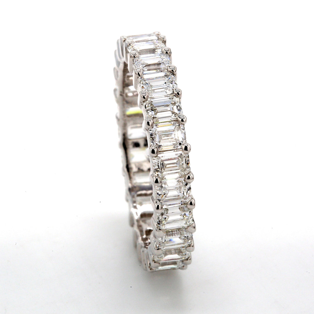 Eternity band with shared prong set (25) emerald cut diamonds. D2.98ct.t.w. Size 6