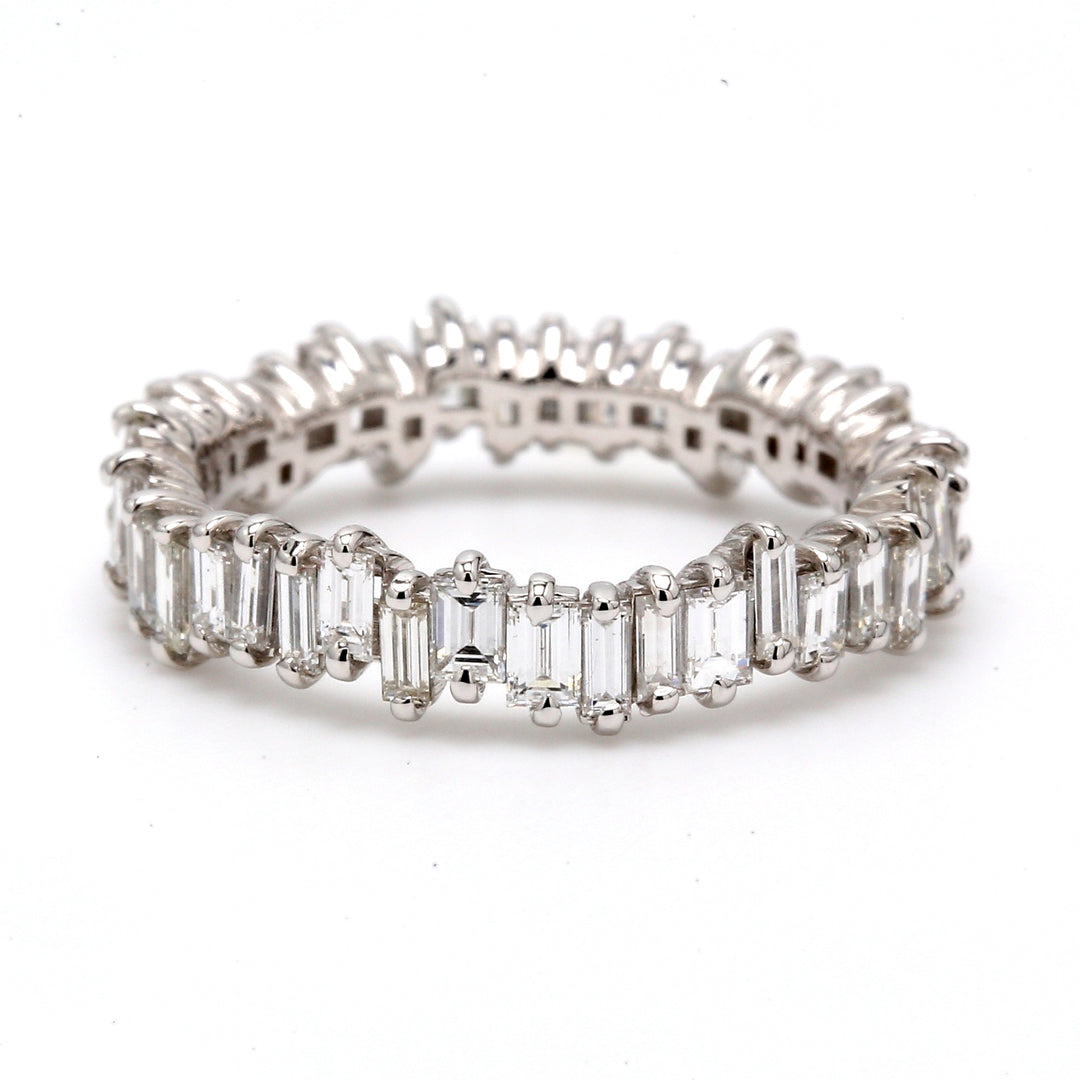 Eternity band in 18K WG with 2-prong set baguette diamonds. D1.97ct.t.w.