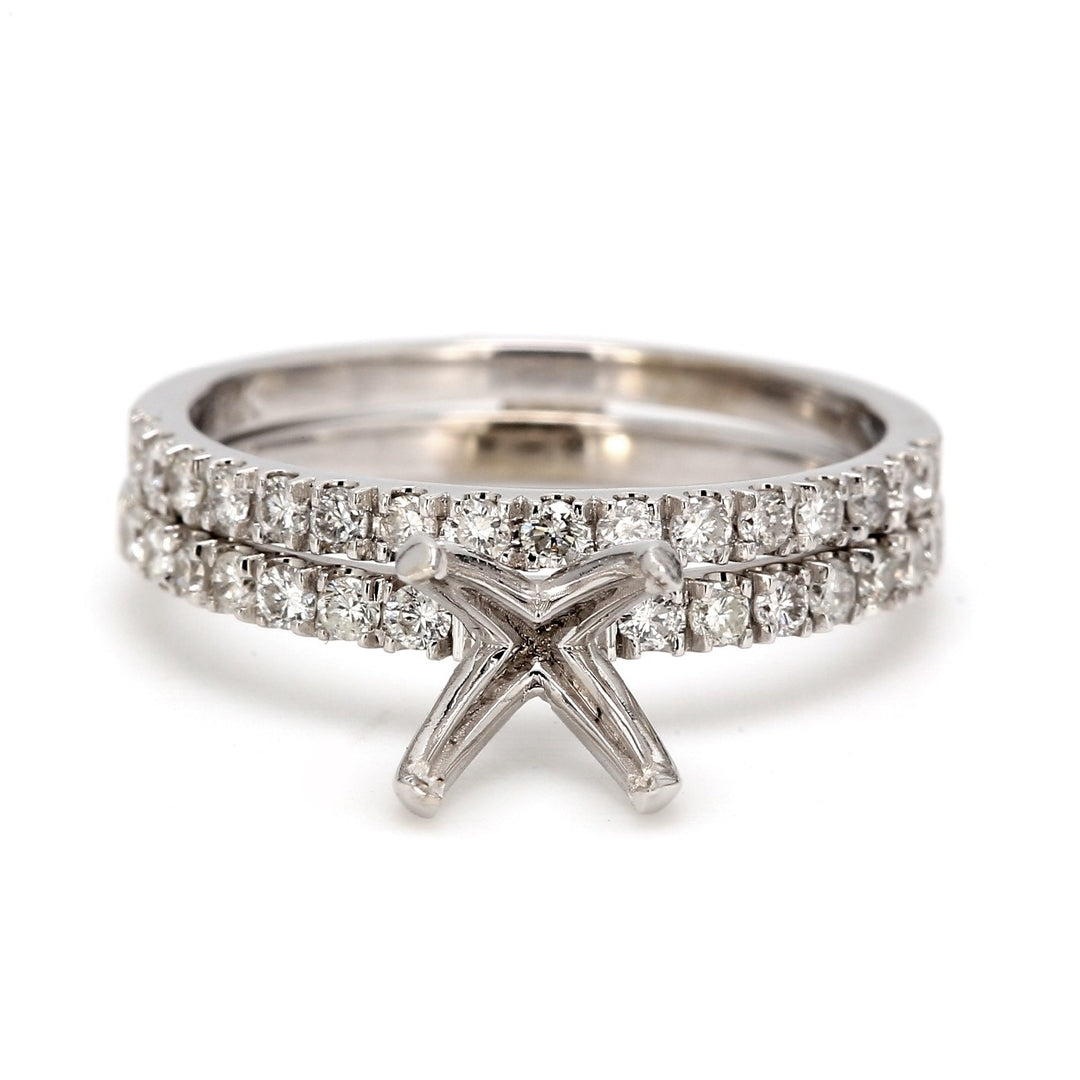 Semi-mount wedding set with prong set round diamonds. D0.50ct.t.w.