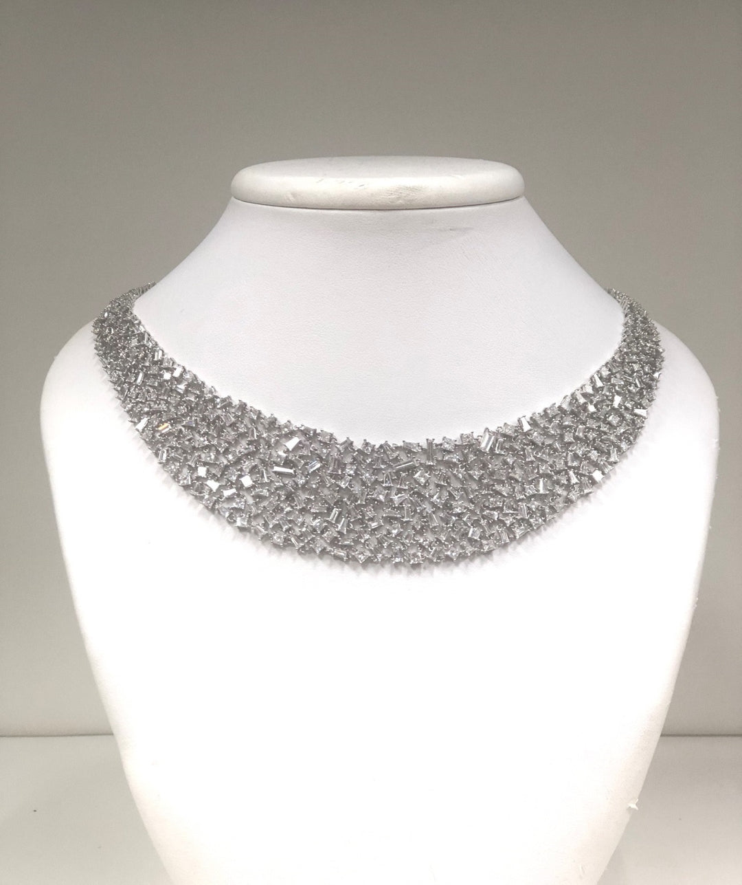 Princess style necklace in 18K WG with prong set princess cuts & baguette diamonds. D22.70ct.t.w.