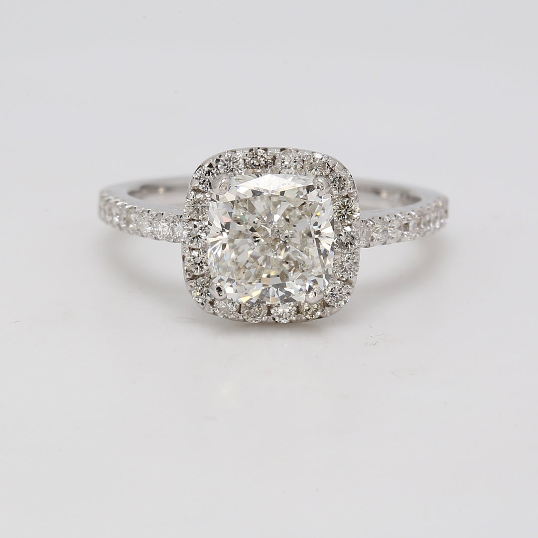 Halo ring with pre-set rounds around GIA certified H/SI2 cushion cut diamond center. D2.49ct.t.w. (Center 2.02ct.) Size 6