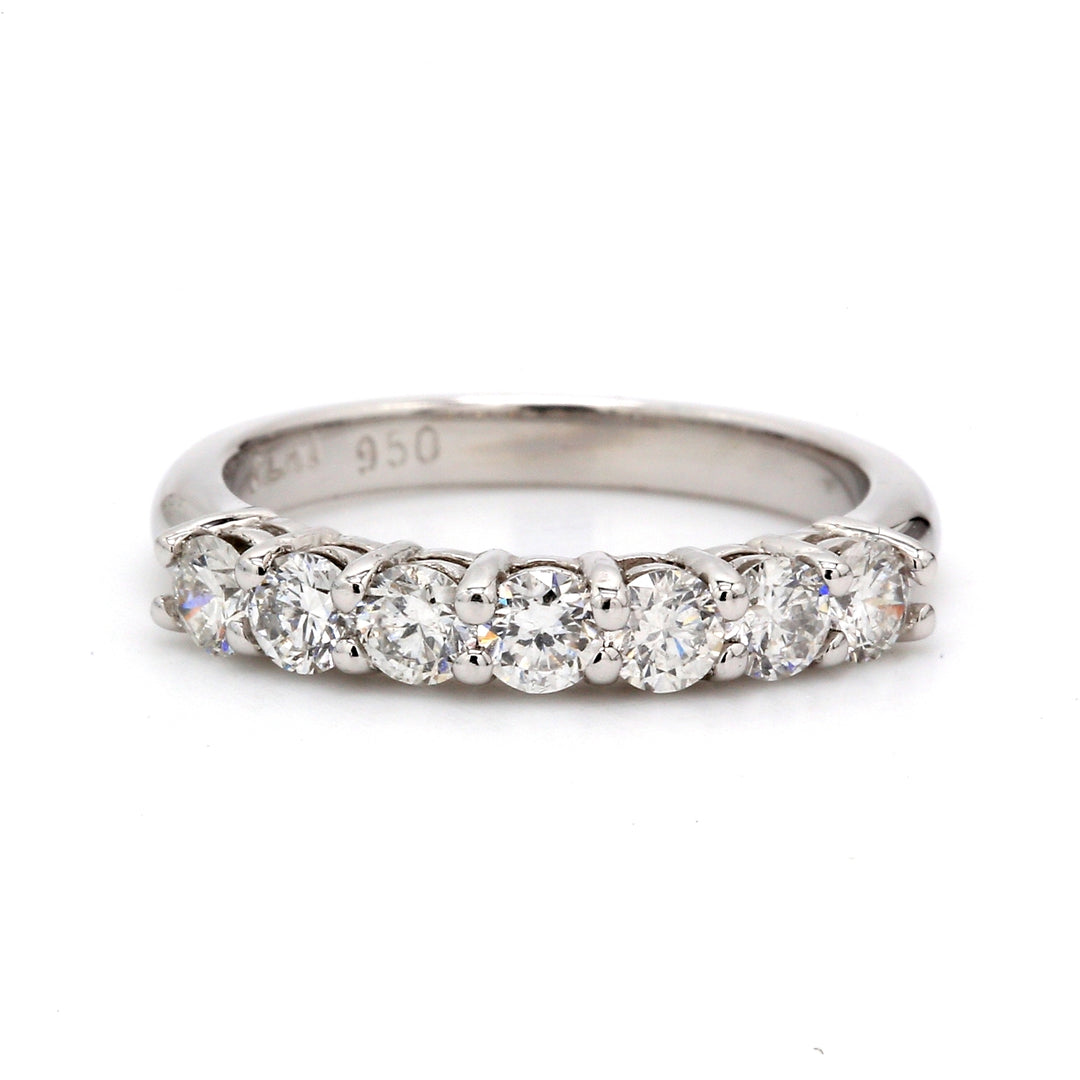 7-stone band in platinum with shared prong set round diamonds. D1.10ct.t.w.