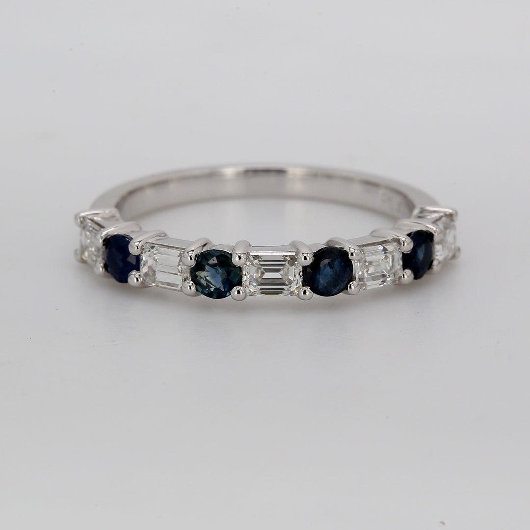 Band in platinum with alternating prong set emerald cut diamonds and round shape sapphires. D0.76ct.t.w. Sapphires 0.53ct.t.w.