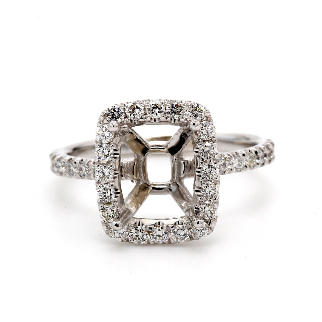 Halo semi-mount with shared prong set round diamonds. D0.55ct.t.w. Size 5.75