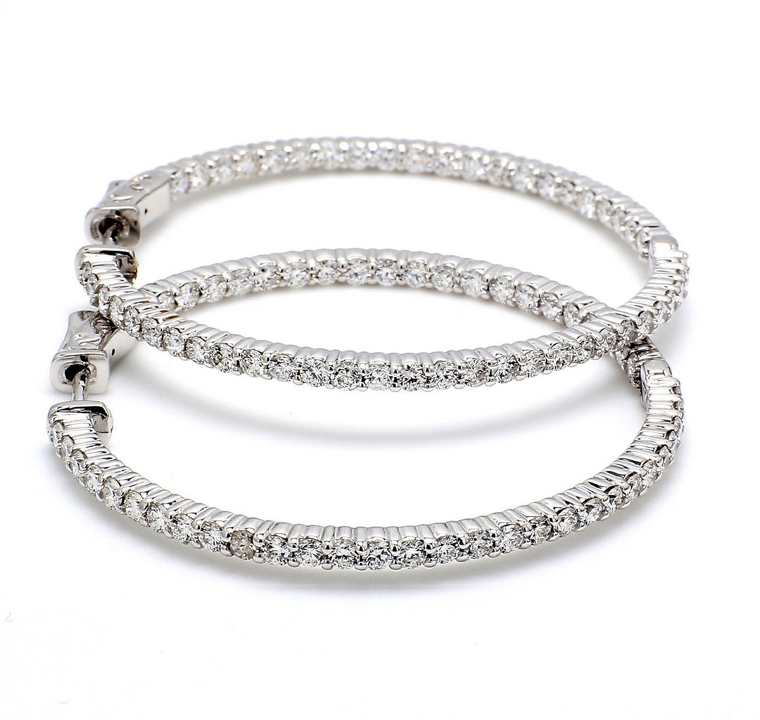 1"" Inside out hoop earrings with shared prong set (40) round diamonds & with special spring lock. D2.02ct.t.w.