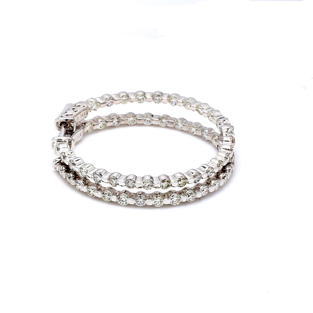 1"" Inside out hoop earrings with channel set (54) round diamonds & with special spring lock. D2.68ct.t.w.