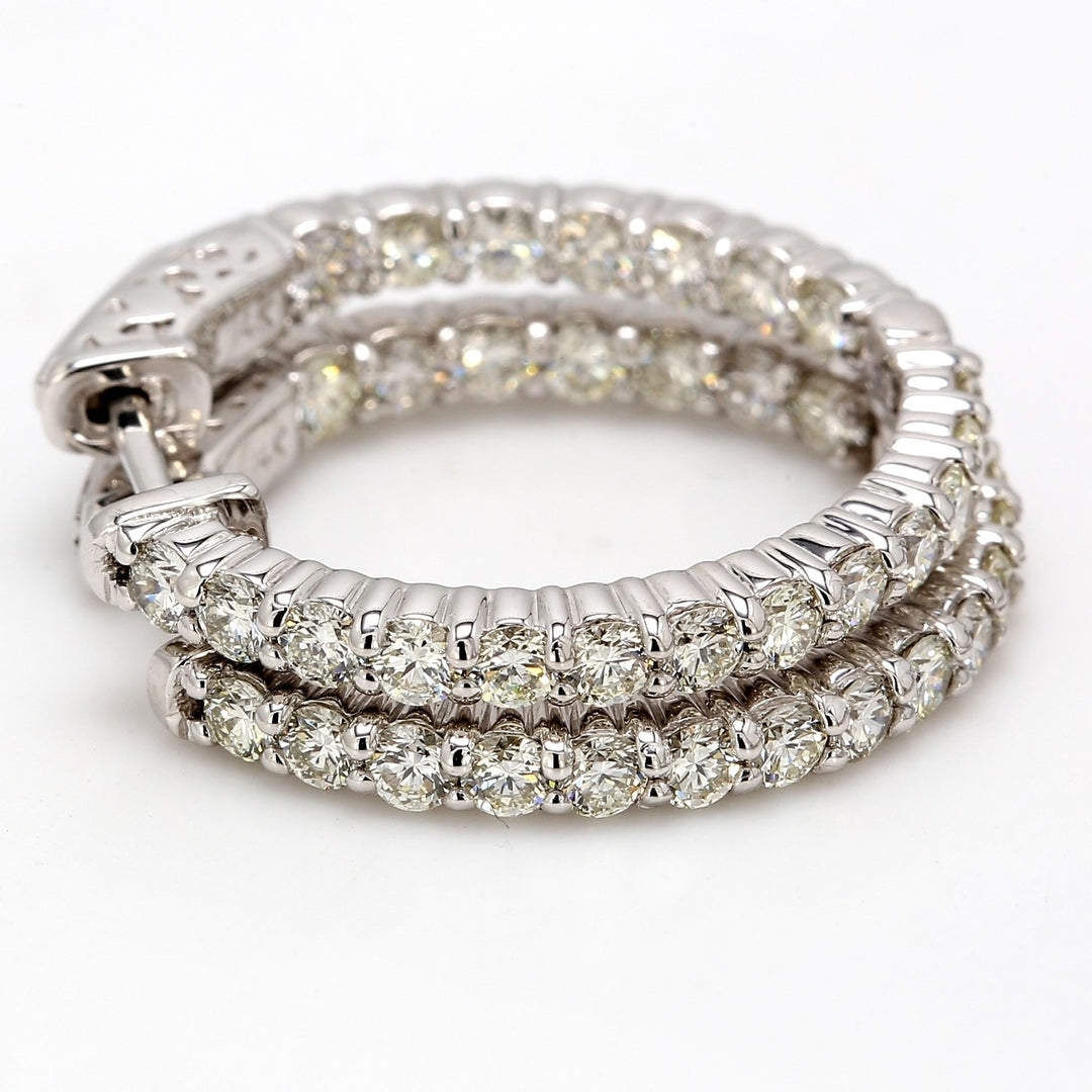 1"" Inside out hoop earrings with prong set (40) round diamonds & with special spring lock. D2.02ct.t.w.