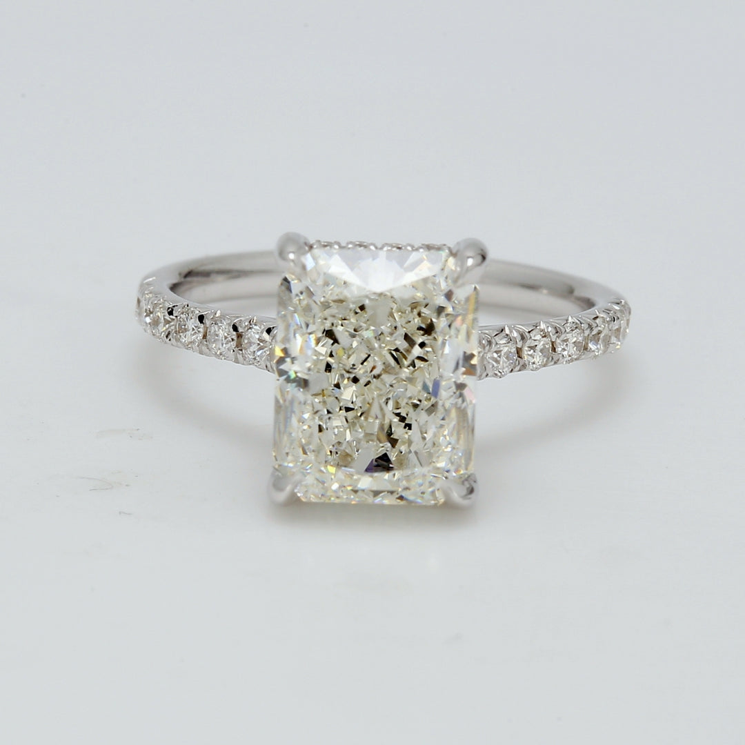 Halo semi-mount in 18K WG with french pave set round diamonds. D0.32ct.t.w. Size 5