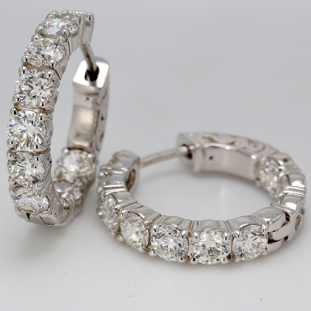 0.75"" Inside out hoop earrings with shared prong set round diamonds. D4.20ct.t.w.