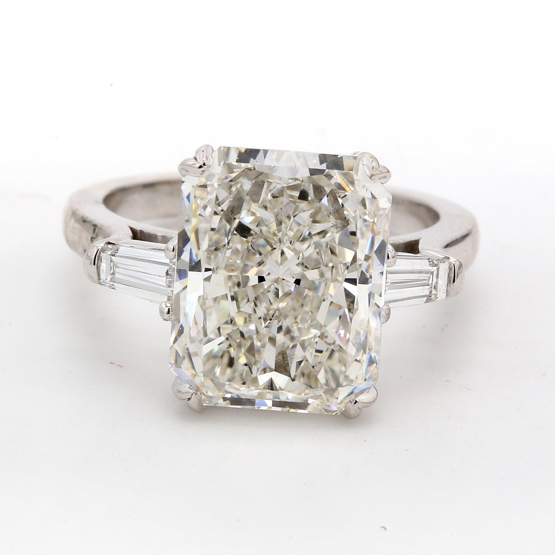 3-stone semi-mount in platinum with channel set baguette diamond sides. D0.50ct.t.w. Size 6.5