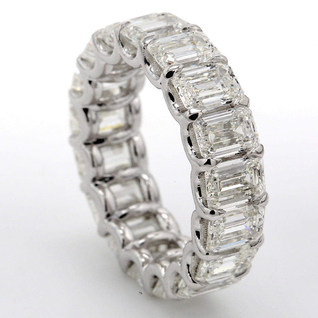 Eternity band in platinum with U-prong set GIA certified D-E/VVS1-VS2 (17) emerald cut diamonds. D8.67ct.t.w. Size 5.75