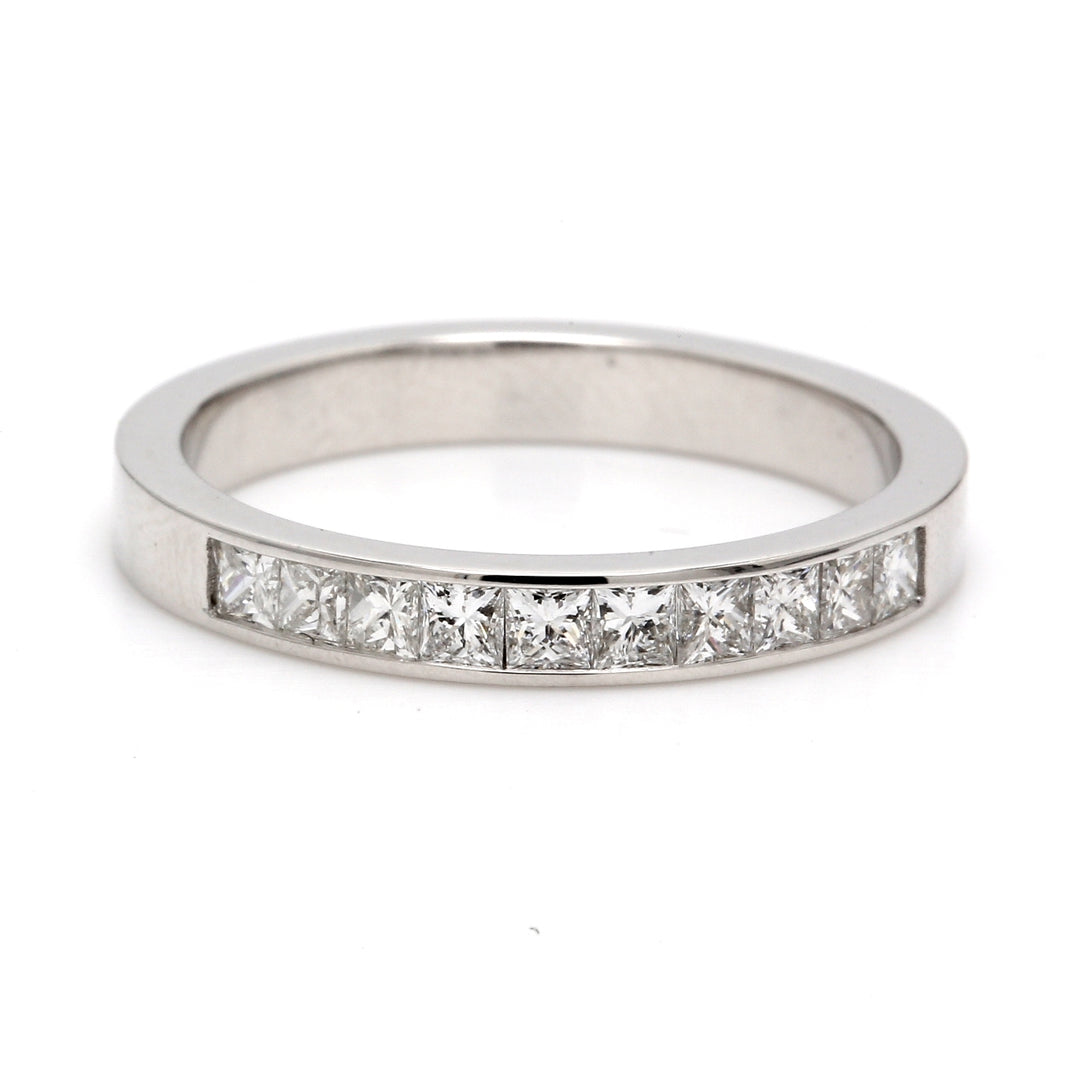 Band in 18K WG with channel set (10) princess cut diamond. D0.60ct.t.w. Size 8.5
