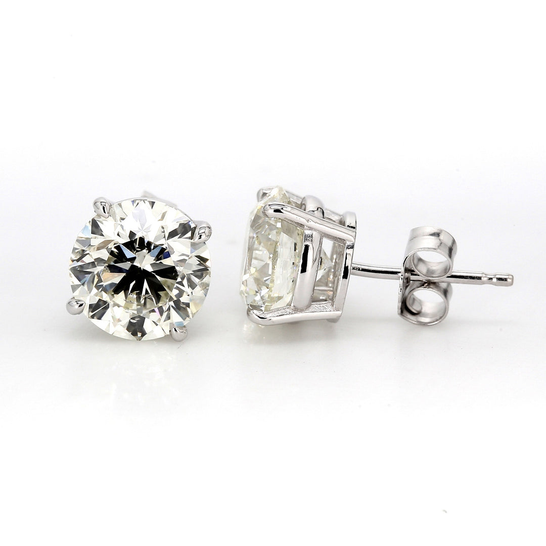 Push back stud earrings with basket 4-prong set GIA certified J/SI2 round diamonds. D4.02ct.t.w.