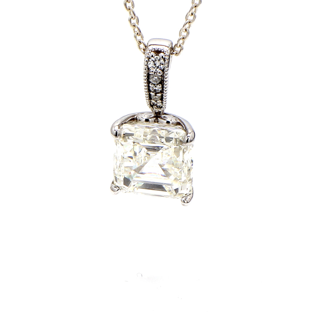 Pendant in 18K WG with pave set rounds and claw prong set GIA certified K/SI2 asscher cut diamond center. D6.36ct.t.w. (Center 6.24ct.)