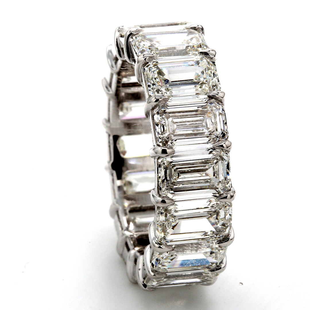 Eternity band in platinum with basket claw set GIA certified G-I/VVS-VS2 (16) emerald cut diamonds. D9.60ct.t.w. Size 5.25