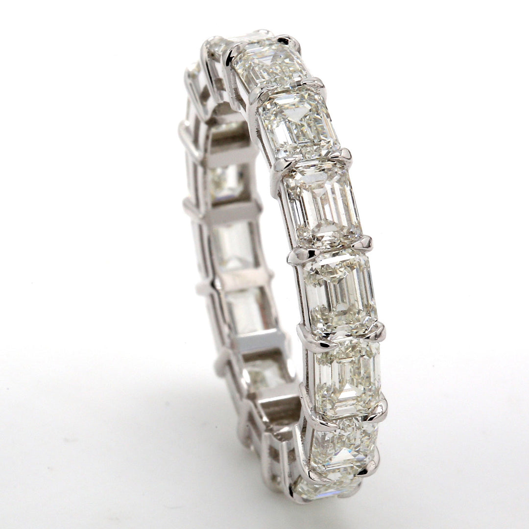 Eternity band east to west style in platinum with claw prong set (16) emerald cut diamonds. D4.83ct.t.w. Size 6