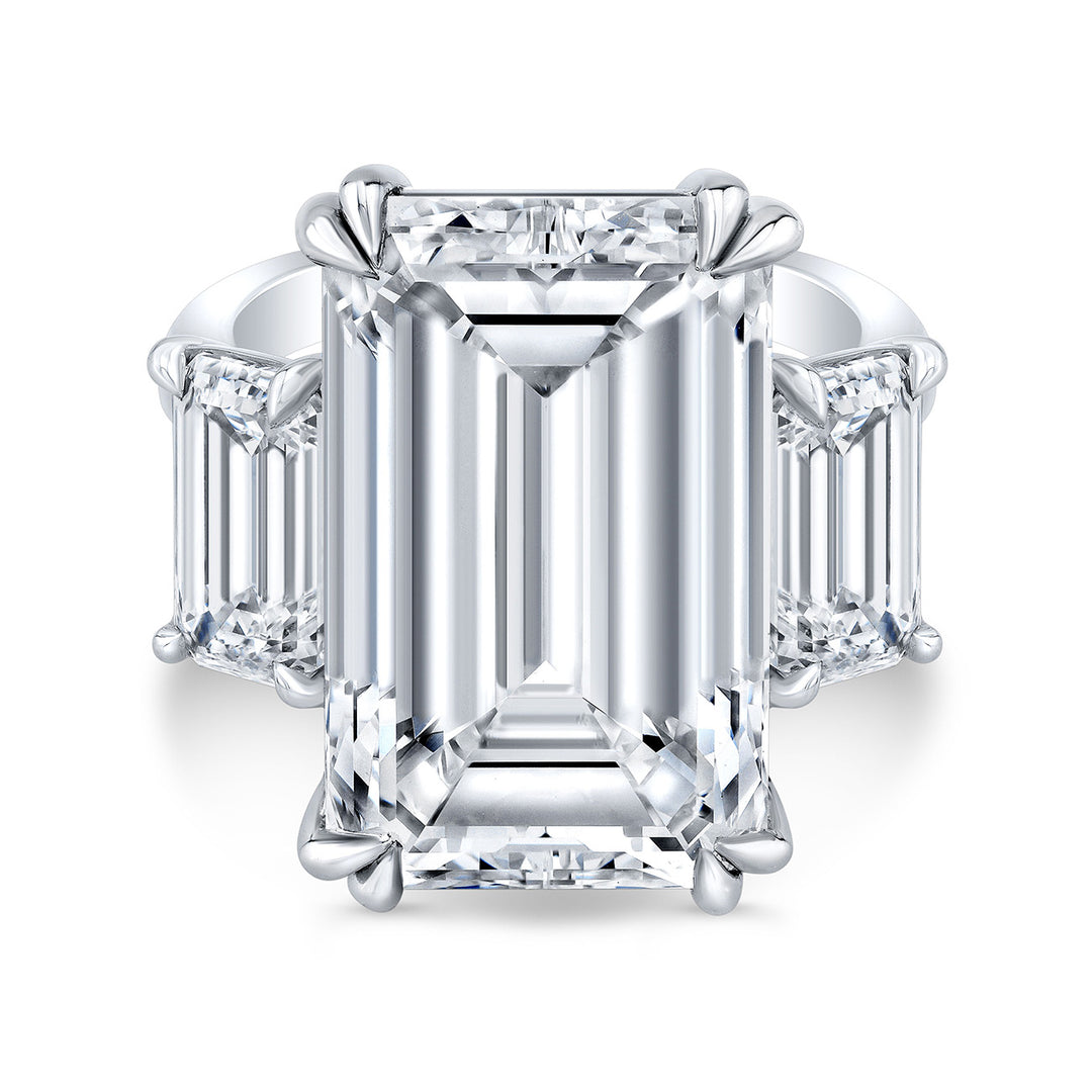 3-stone ring in platinum with claw prong set GIA certified K/VS2 emerald cut center and emerald diamond sides. D18.14ct.t.w. (Center 15.14ct.) Size 6