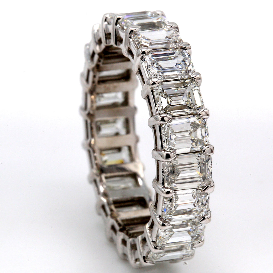 Eternity band in platinum with basket prong set (21) emerald cut diamonds. D6.00ct.t.w. Size 8