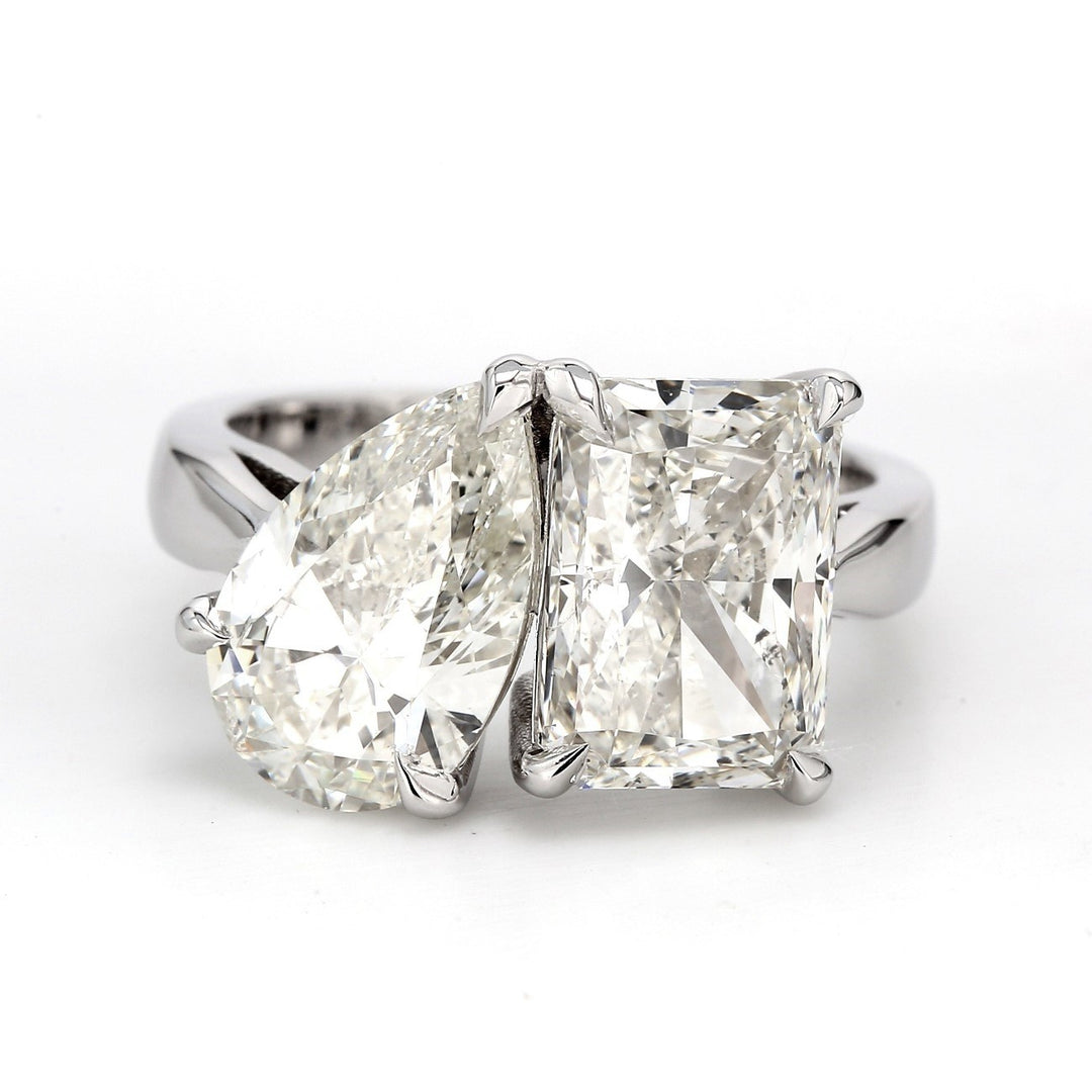 2-stone ring with claw prong set pear shape and radiant cut diamonds. D5.08ct.t.w.
