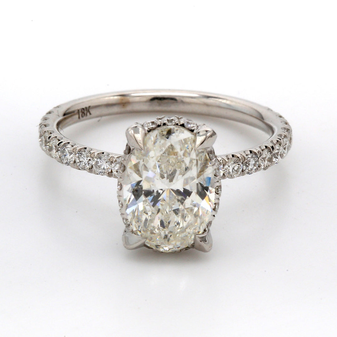 Semi-mount for oval center in 18K WG with pave set (54) round diamonds. D0.95ct.t.w. Size 6