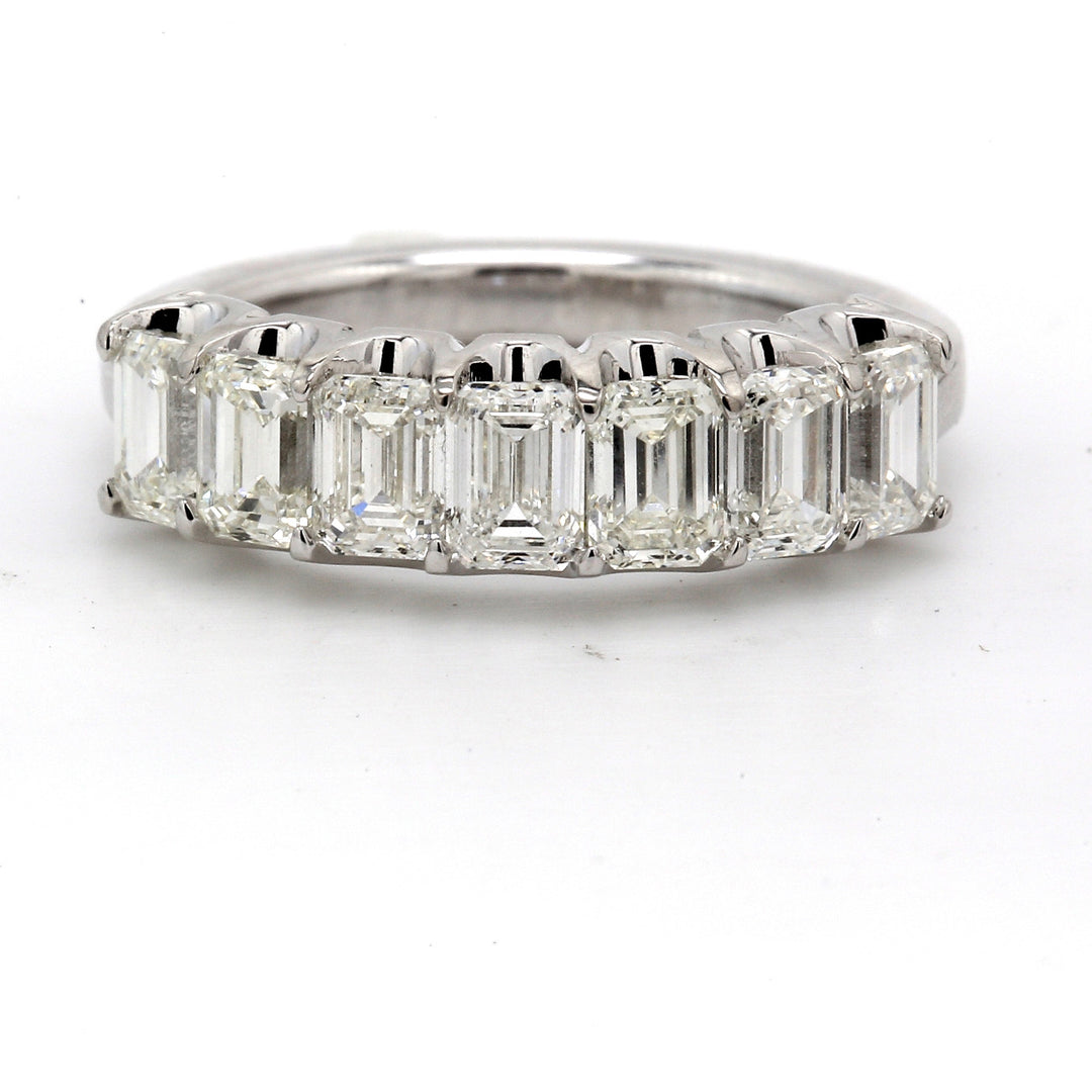 7-stone band in platinum with U-prong set emerald cut diamonds. D2.16ct.t.w. Size 6